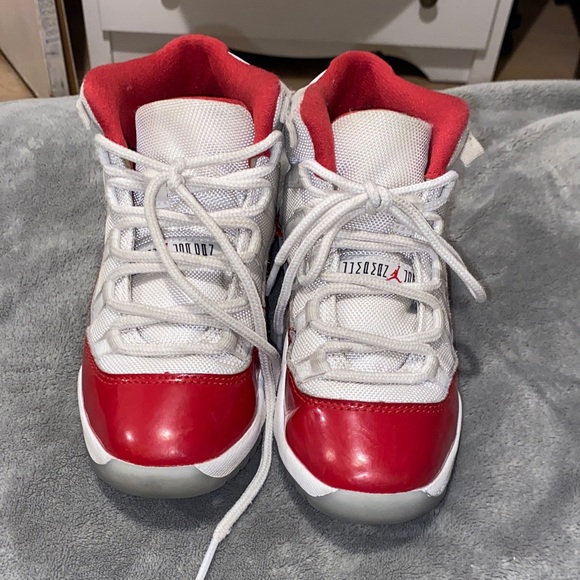 Kids Red and White Jordan 11 retro Sneakers - Picture 1 of 8